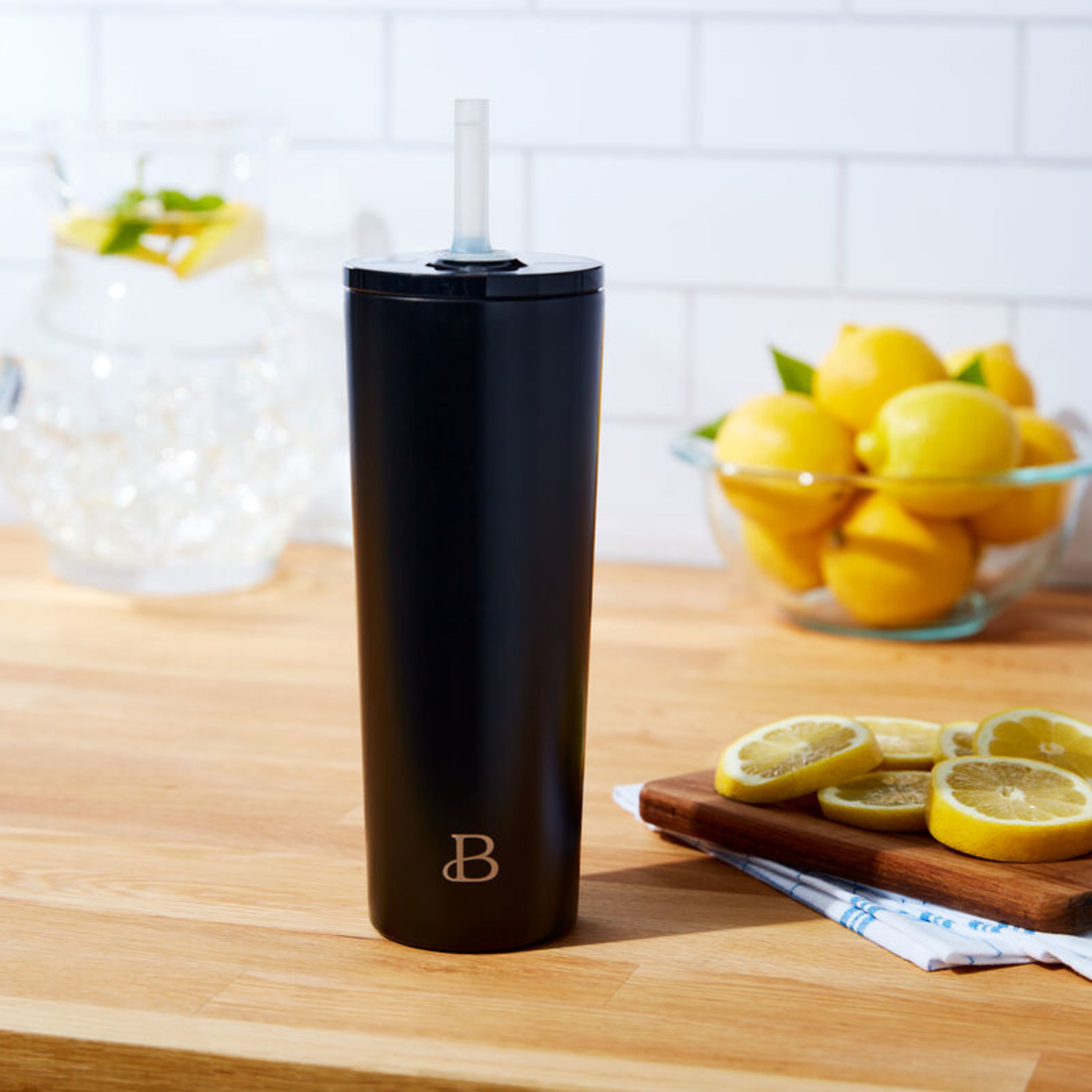 tumbler with attached straw on a kitchen counter