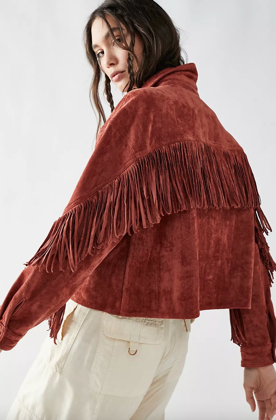 model wearing the red shacket with tassels