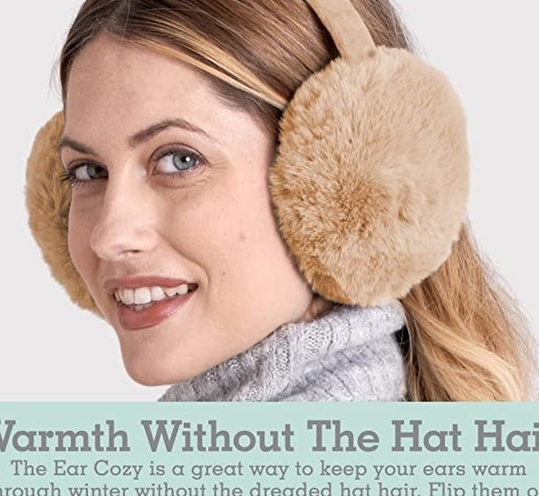 a person wearing the ear muffs in front of a plain background