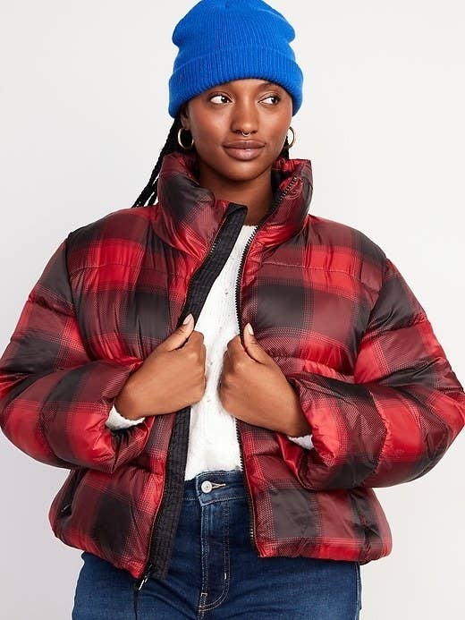 a model wearing the red and black plaid jacket