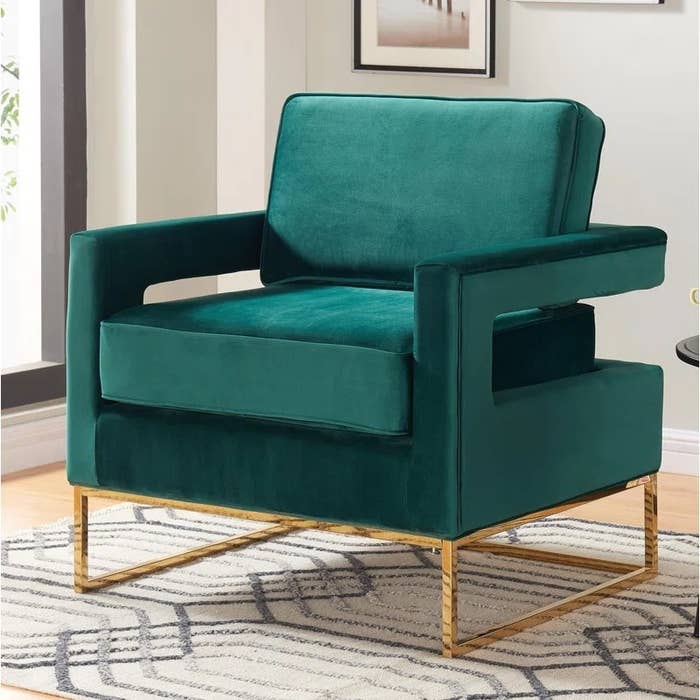 Green armchair on rug