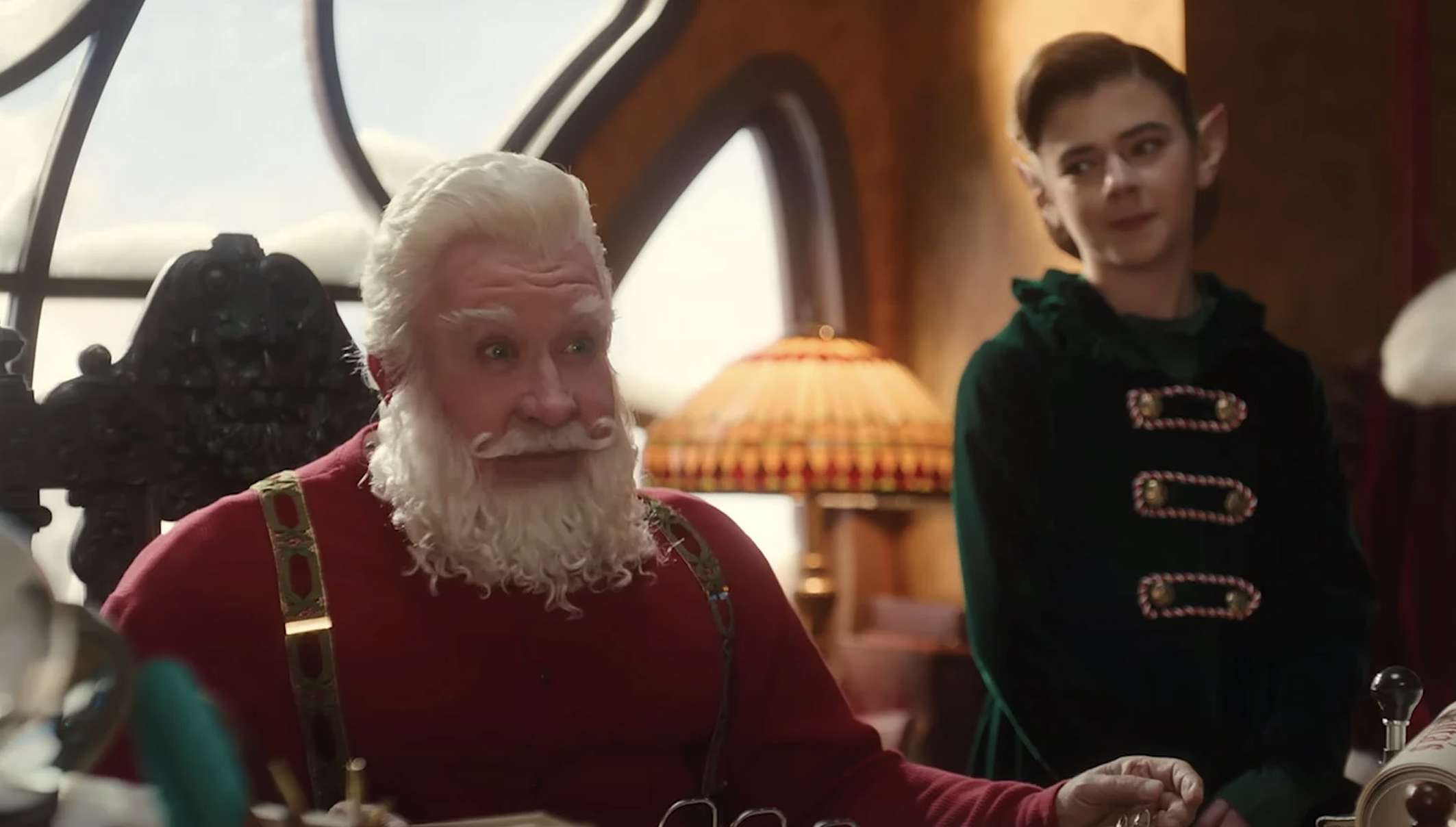 Santa and an elf by his side