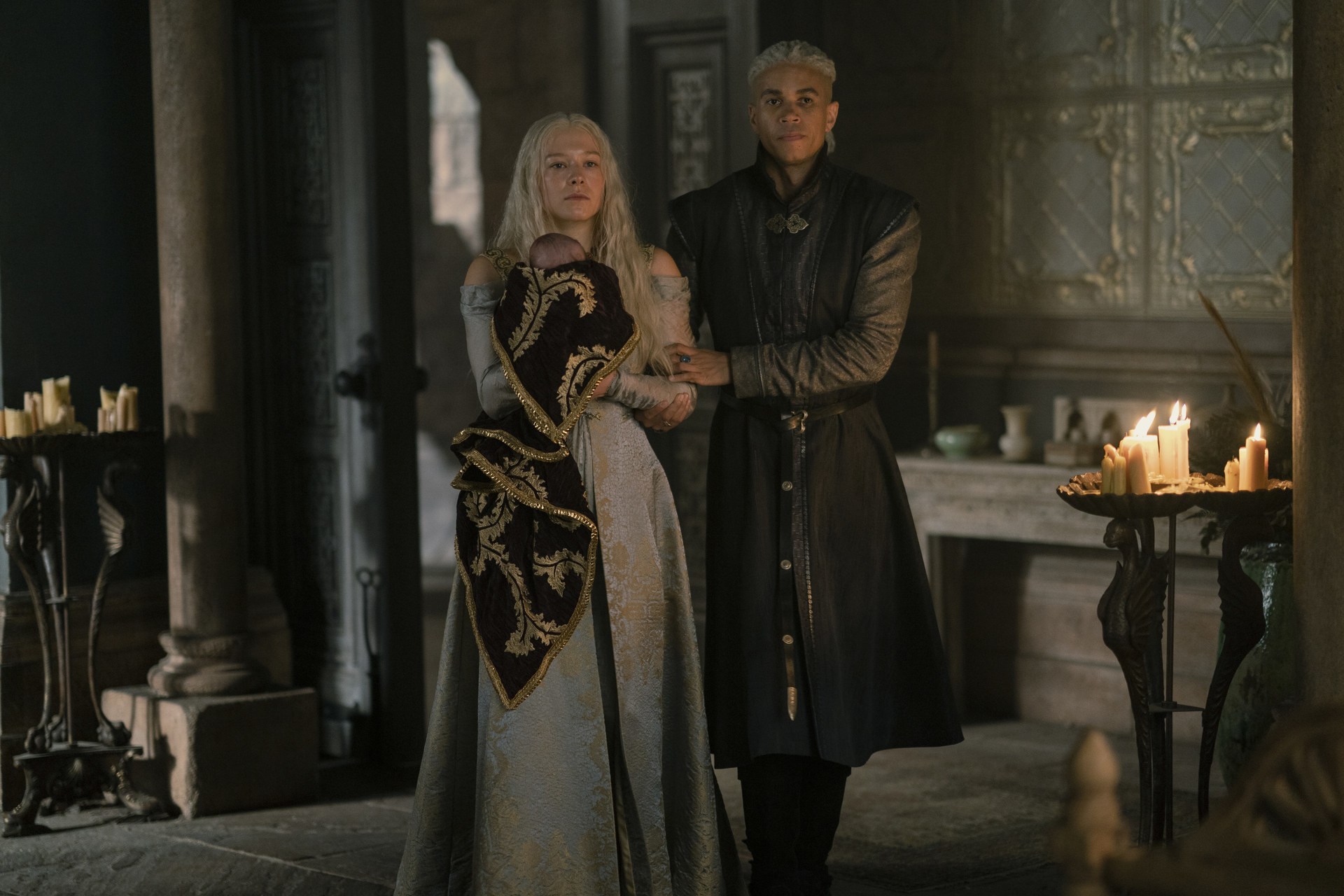 Laenor and Rhaenyra stand in Alicent&#x27;s chamber, Rhaenyra holds her baby