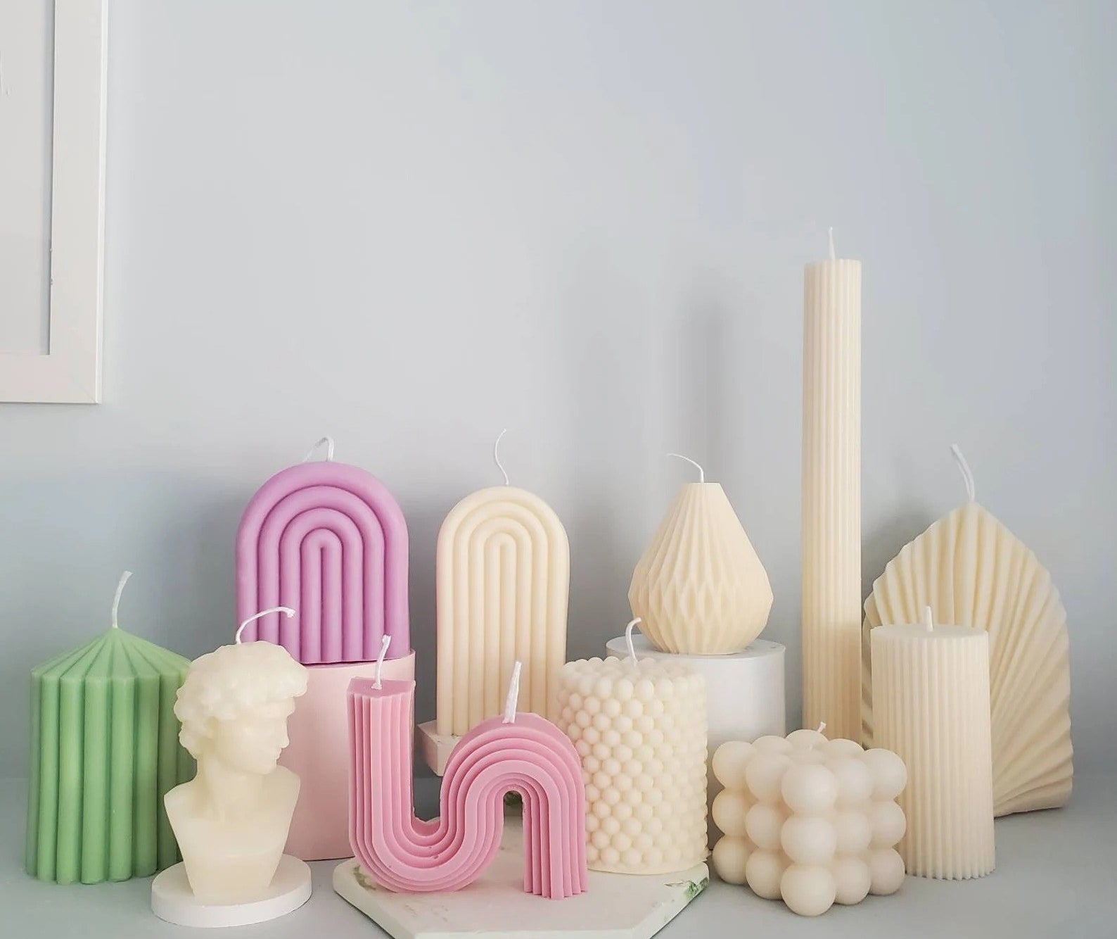 A variety of different shaped candles are shown
