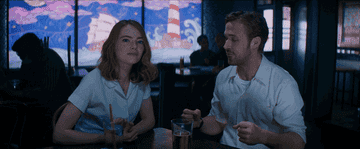 A couple drinking at a bar