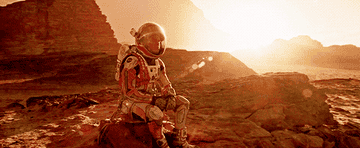 An astronaut sitting in a planet