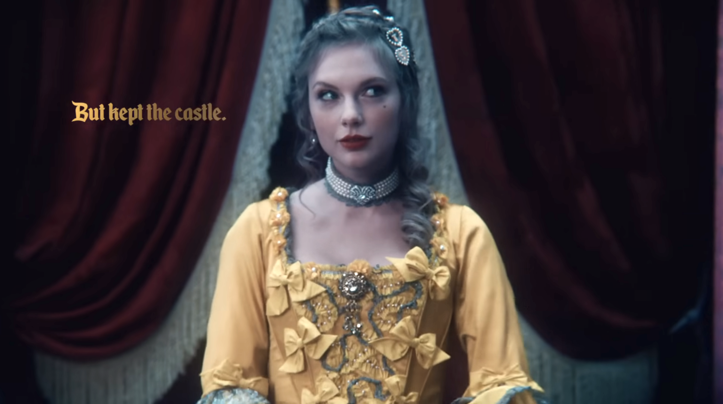 Taylor wearing a corseted dress with the caption &quot;But kept the castle&quot; next to her