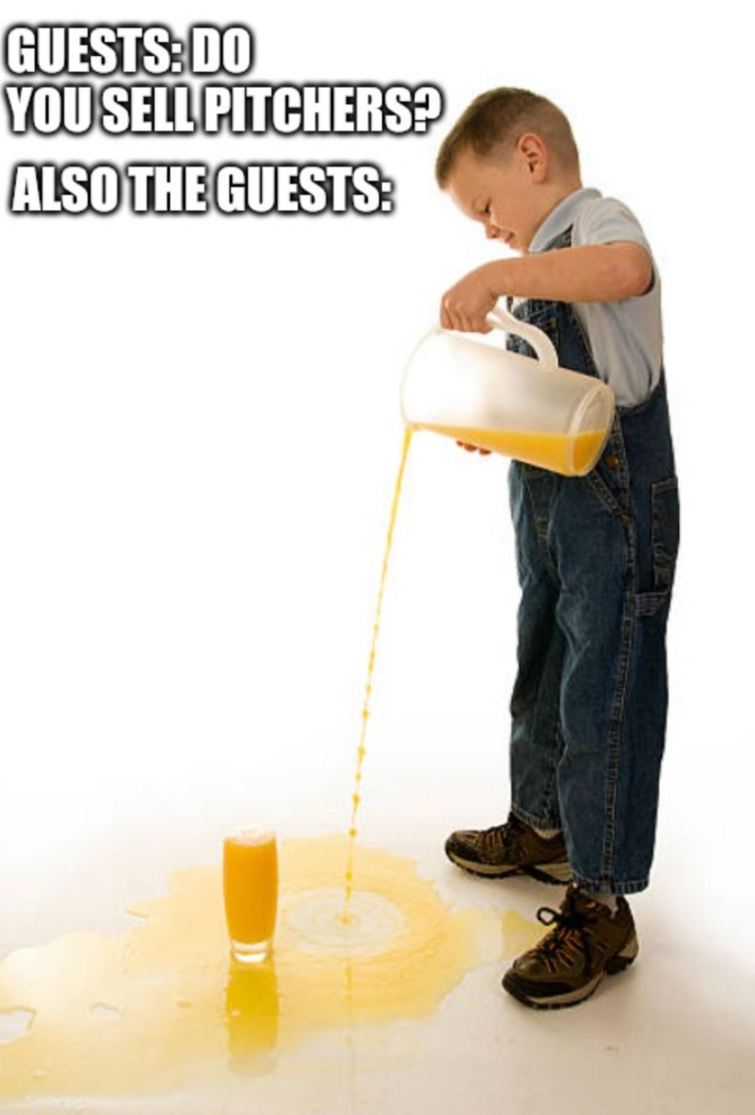 A little boy spilling juice on the floor