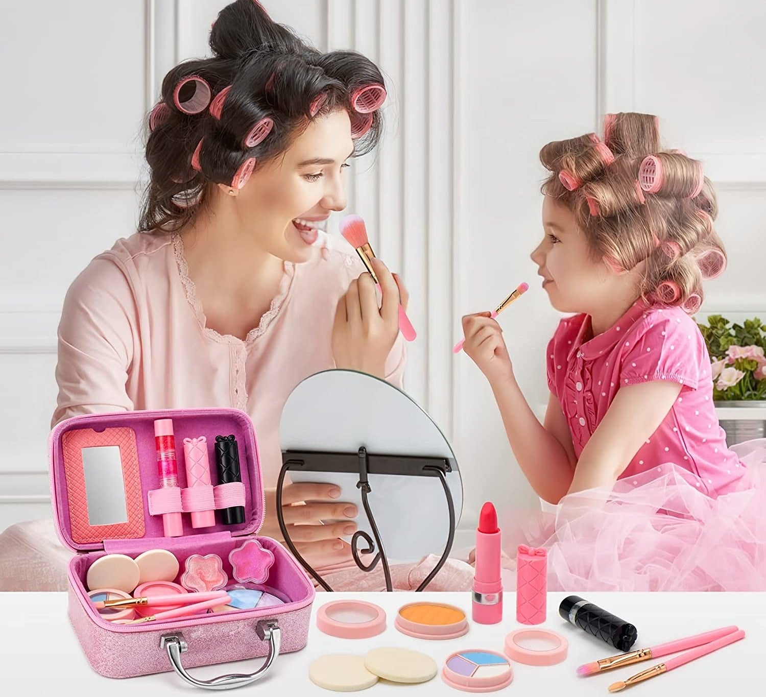 a child and parent doing their makeup together