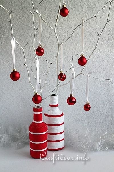 red and wine yarn wrapped bottles made into upcycled ornamented trees for holiday decor dsiplay
