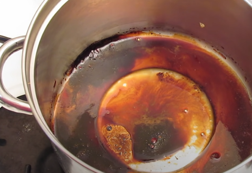 burnt caramel stuck to the bottom of a pan