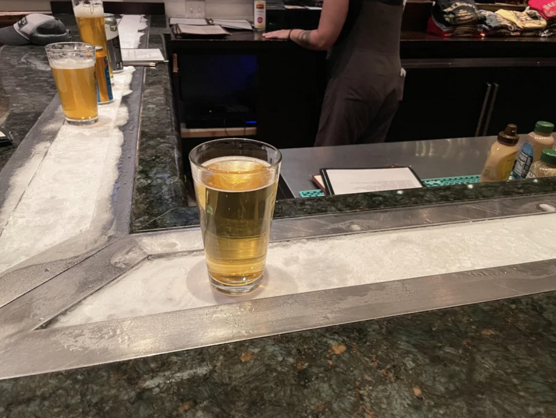 A chilled strip on a bar to keep drinks cold