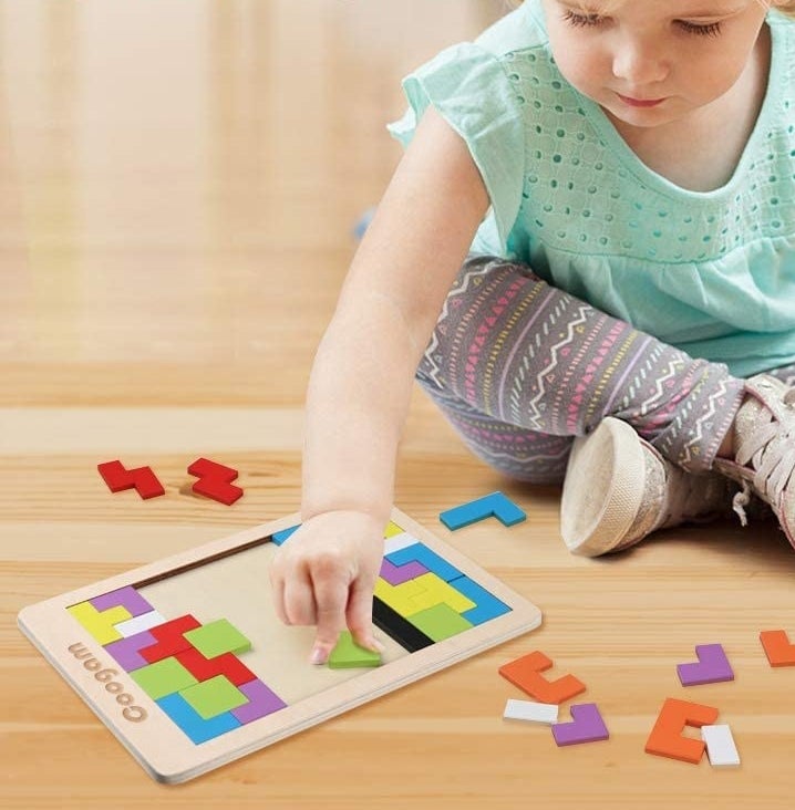 a kid playing with the puzzle