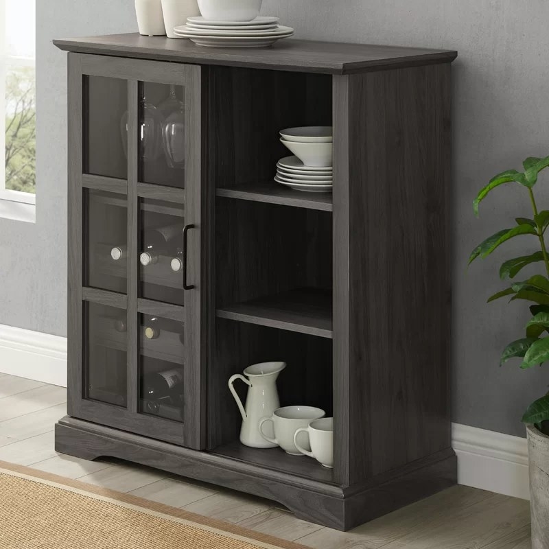 Grey bar with tableware and glasses inside