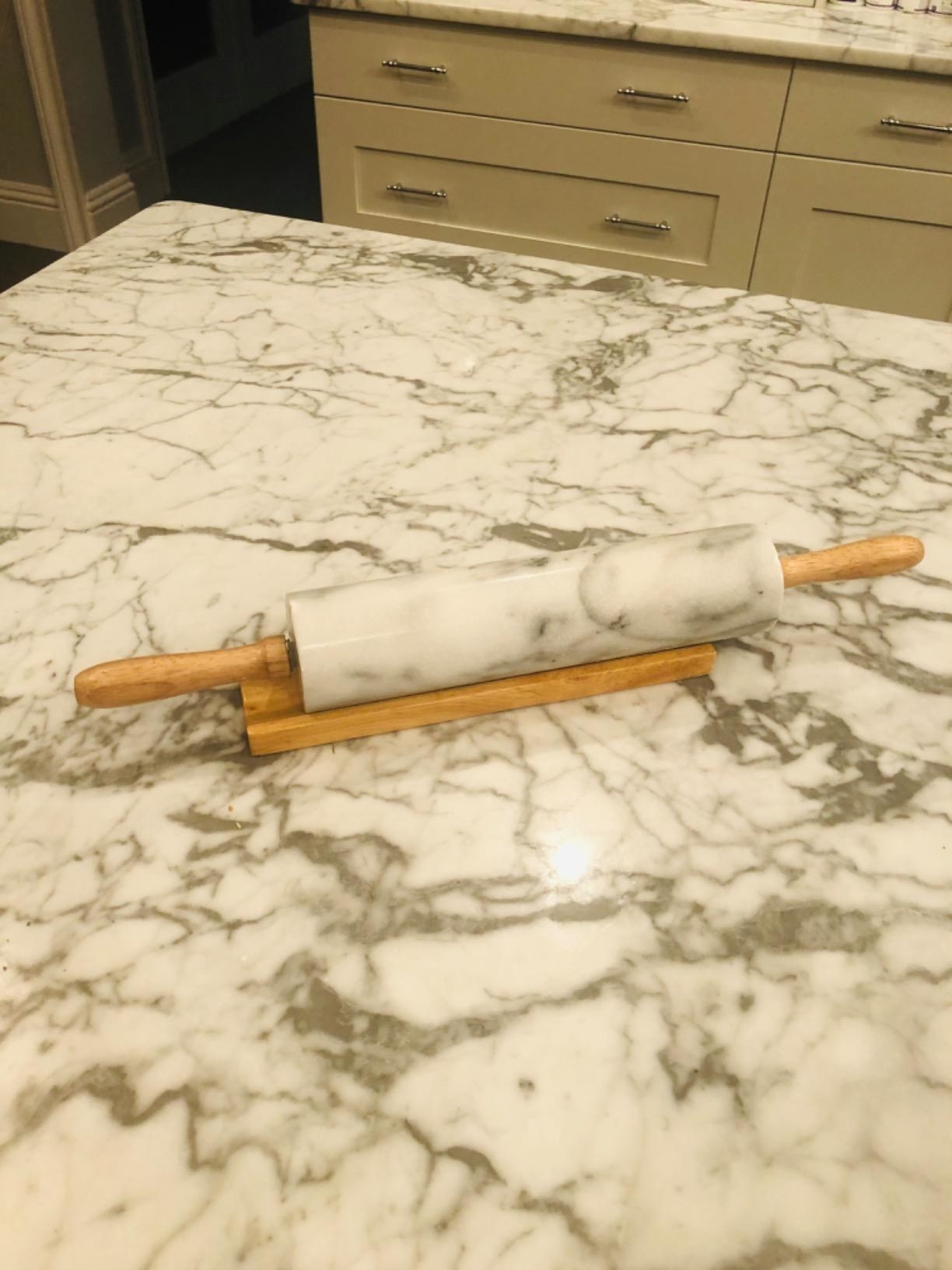 Reviewer image of rolling pin in stand on marble counter