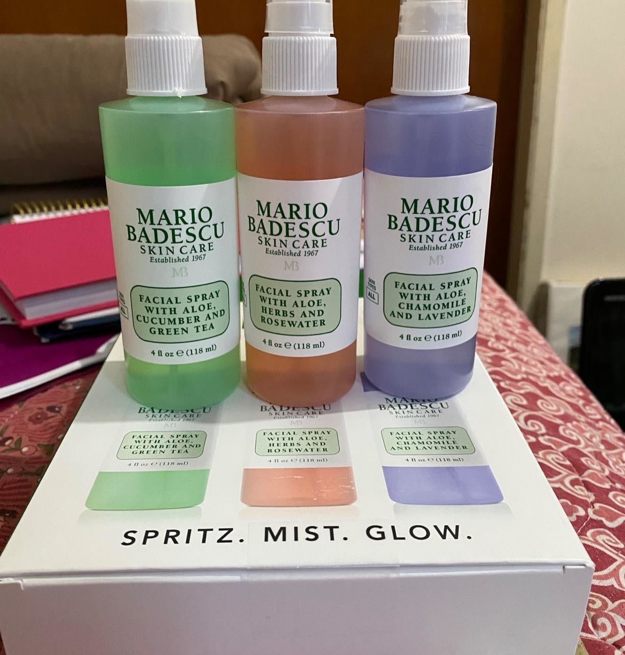 Reviewer image of three facial spray bottles