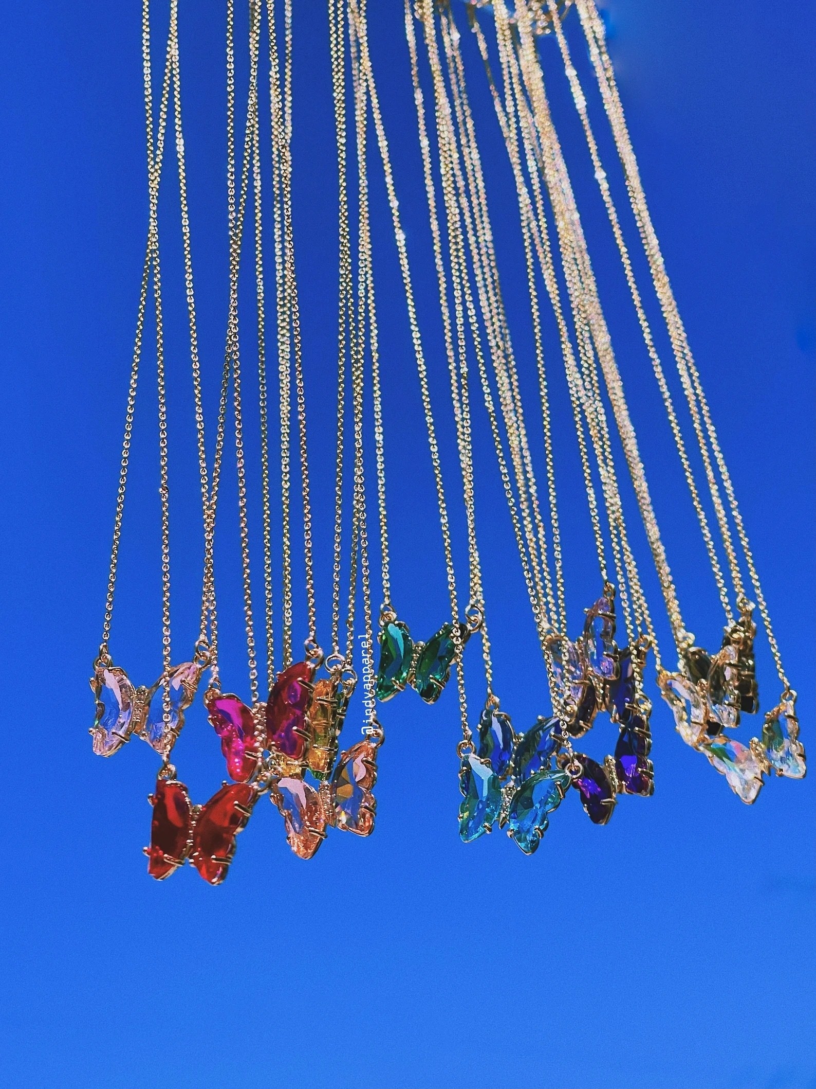 The butterfly necklace in several different colors