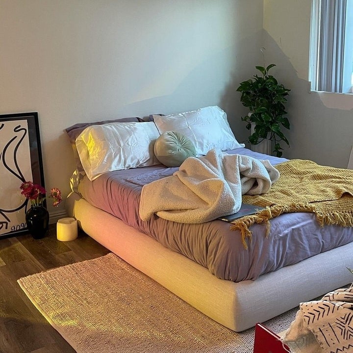 an upholstered soft bed frame