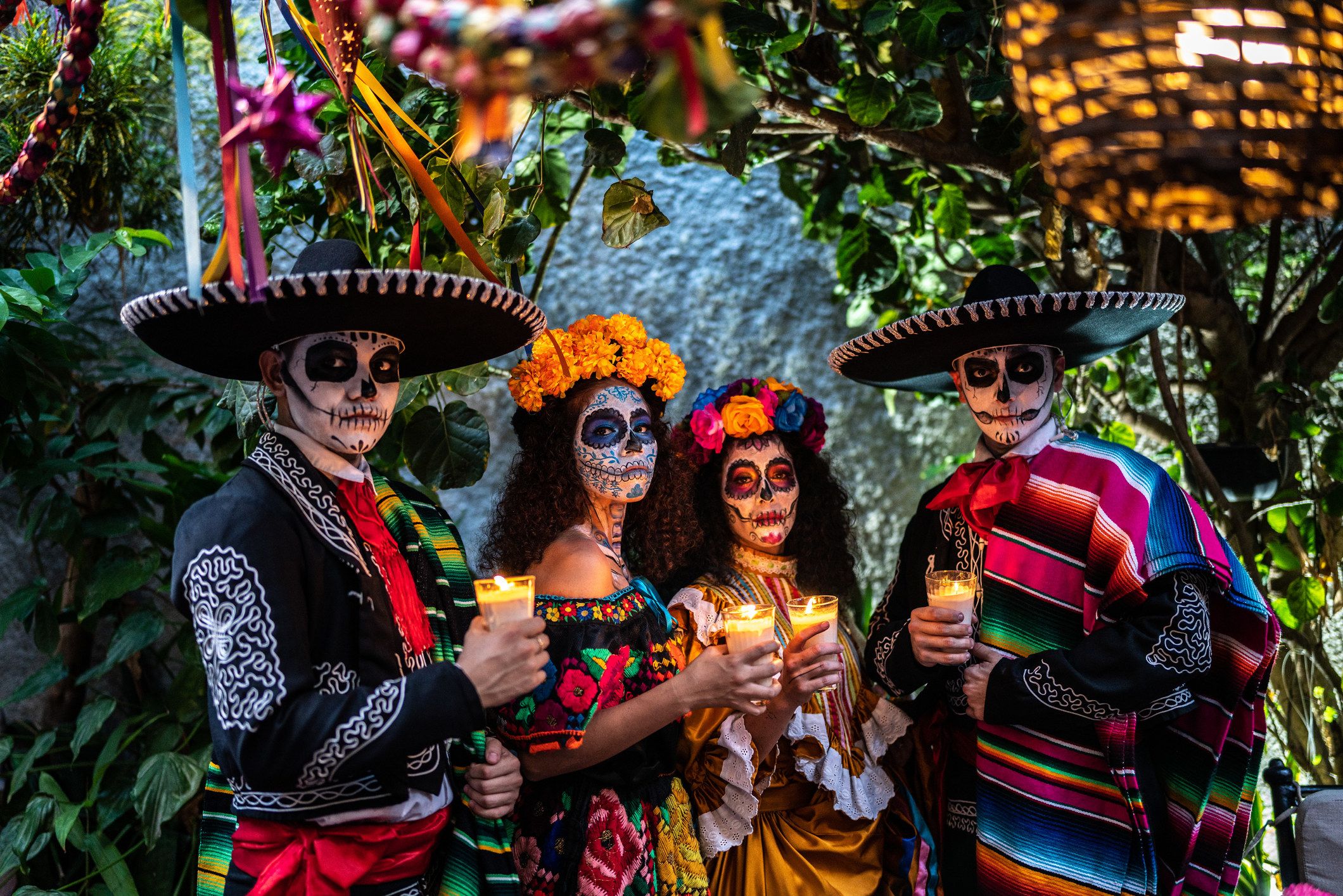4 people dressed in Mexican attires