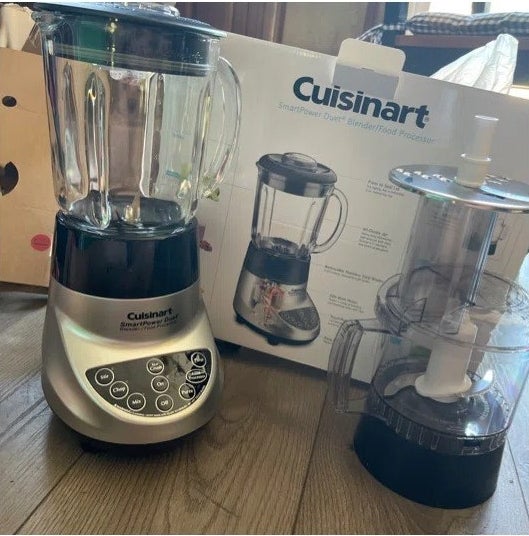 a reviewer photo of the blender and food processor next to the box