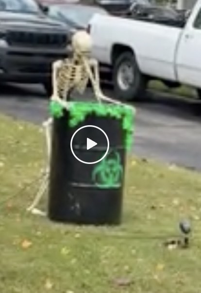 skeletons hunching over a trash can