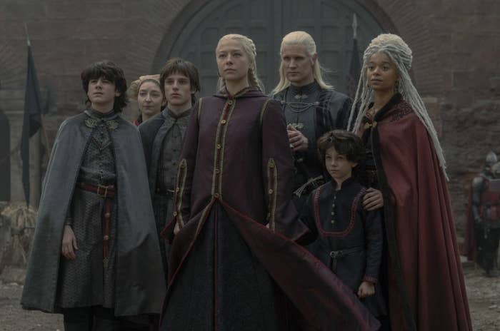 Rhaenyra stands with her family in the courtyard of the Red Keep