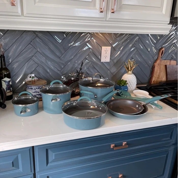 A set of blue pans and pots in a reviewer&#x27;s home