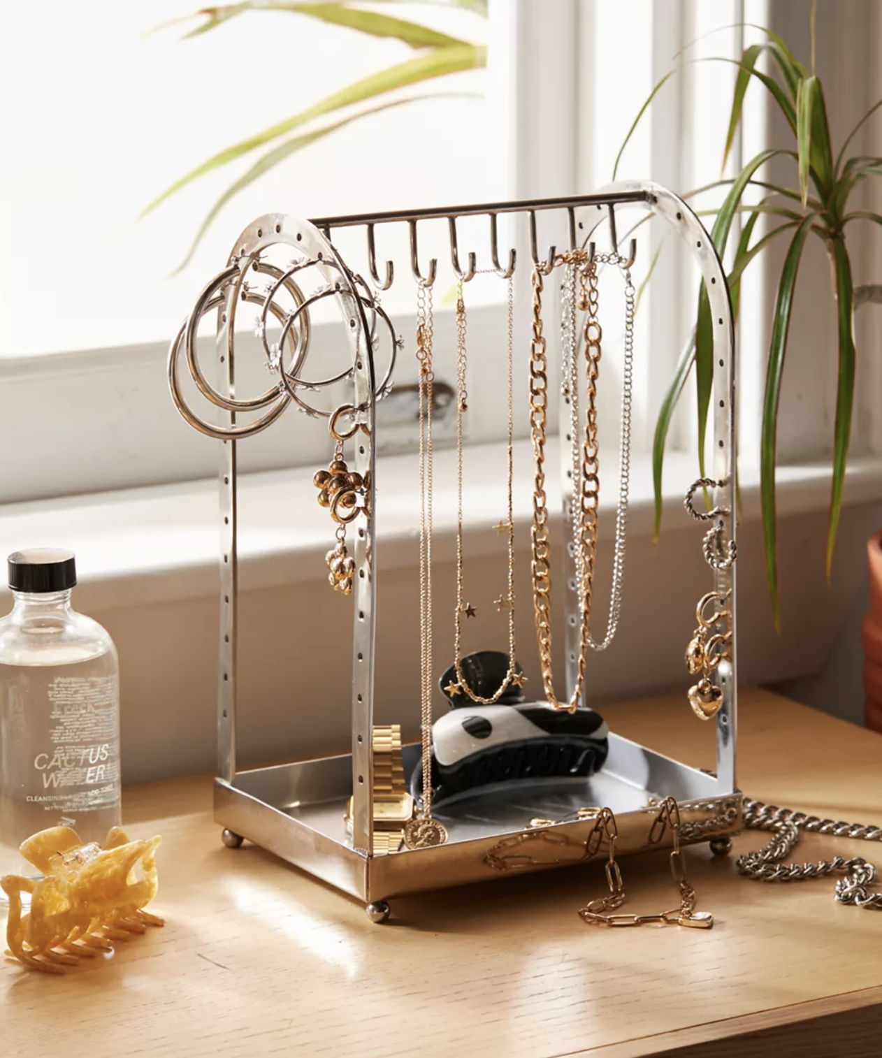 Several chains and hoops on the jewellery organizer