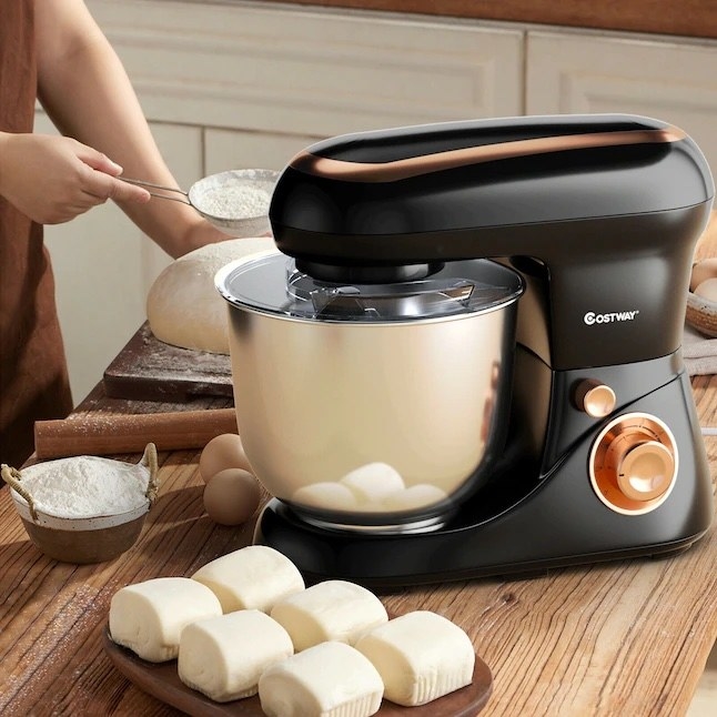 The stand mixer next to some pastries