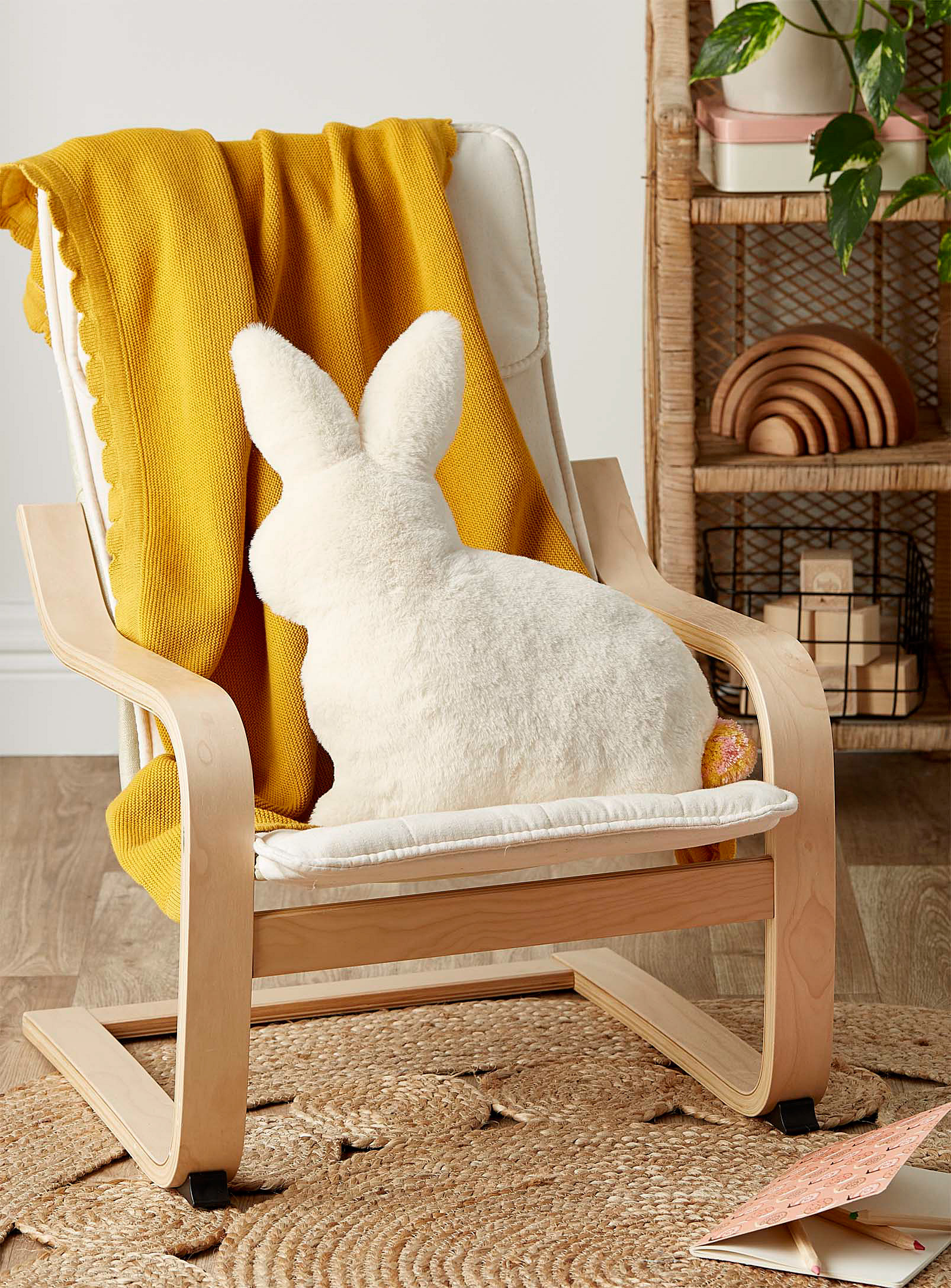 the bunny cushion on a chair