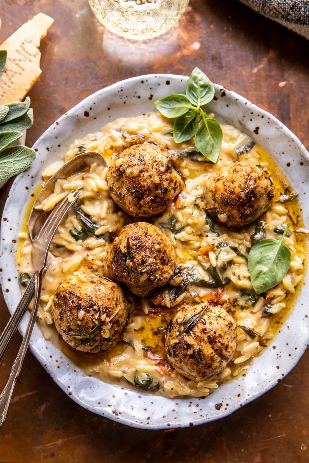 chicken meatballs on a plate with creamy orzo