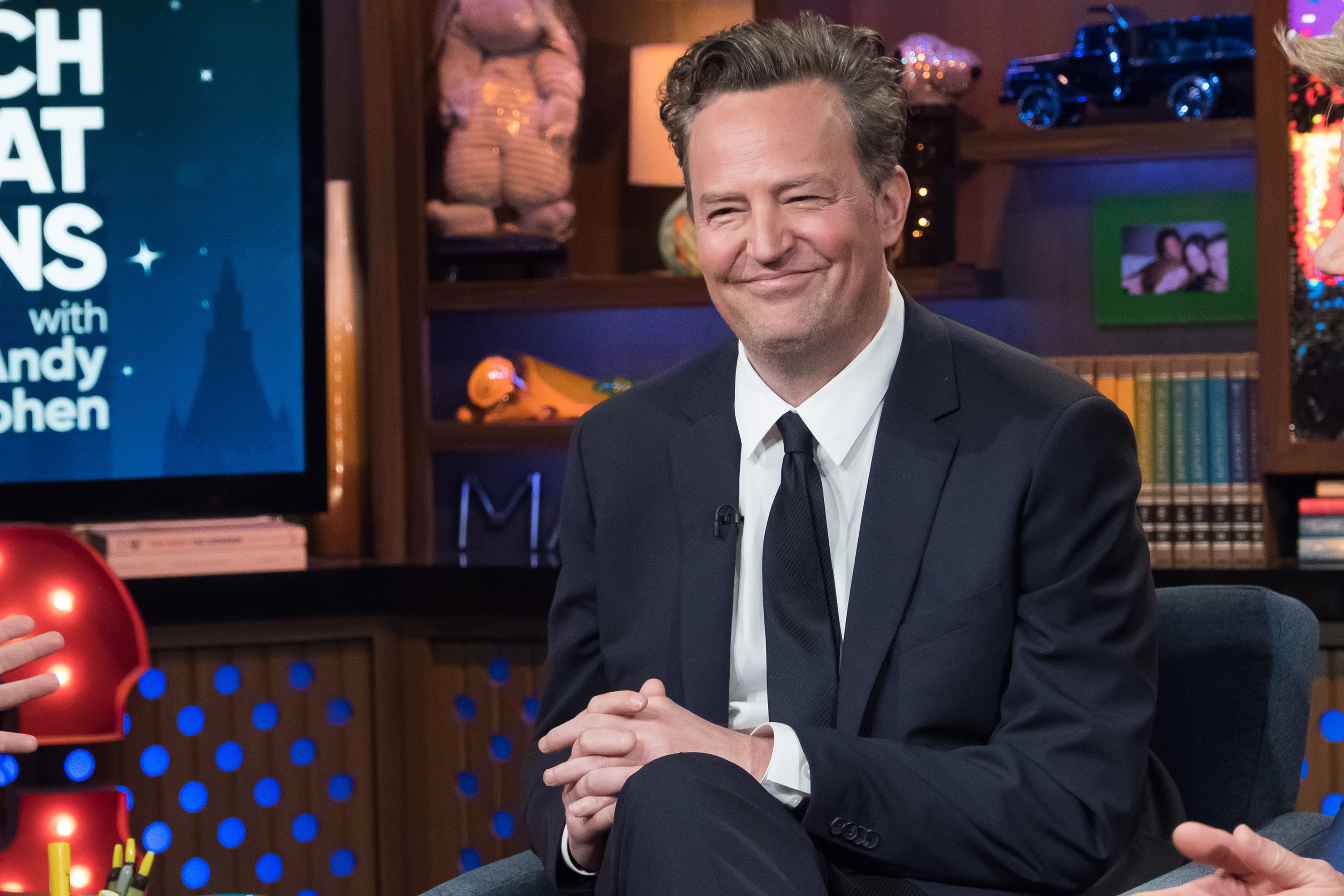 Matthew smiling on the Watch What Happens Live show with Andy Cohen