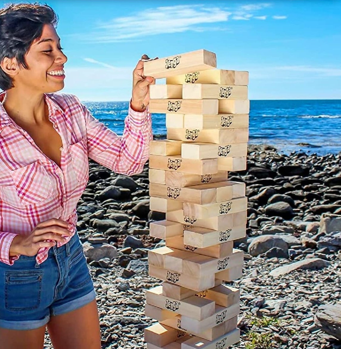 a person playing the game with a tower that is taller than them