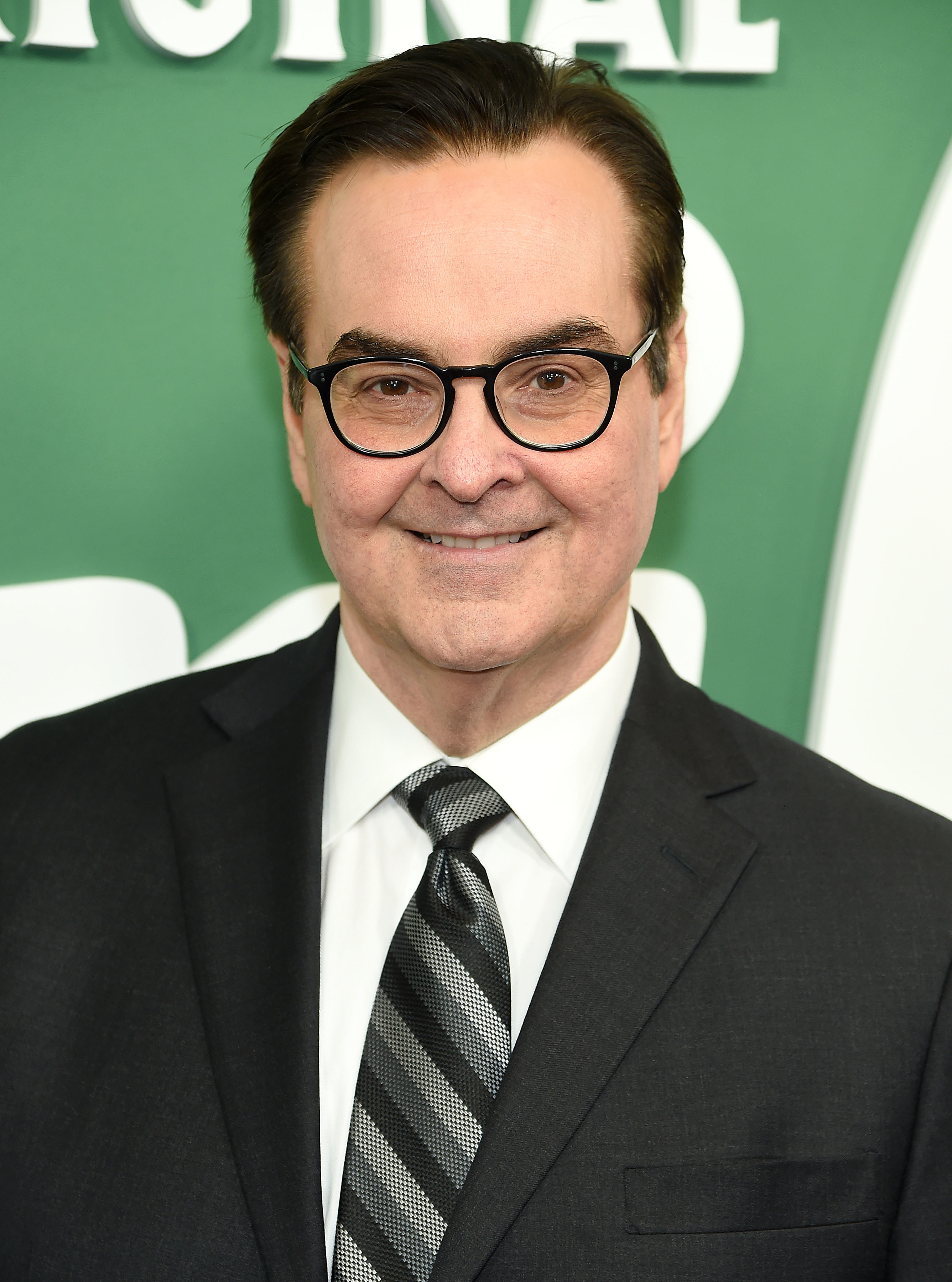 Close-up of smiling Steve in a suit and tie