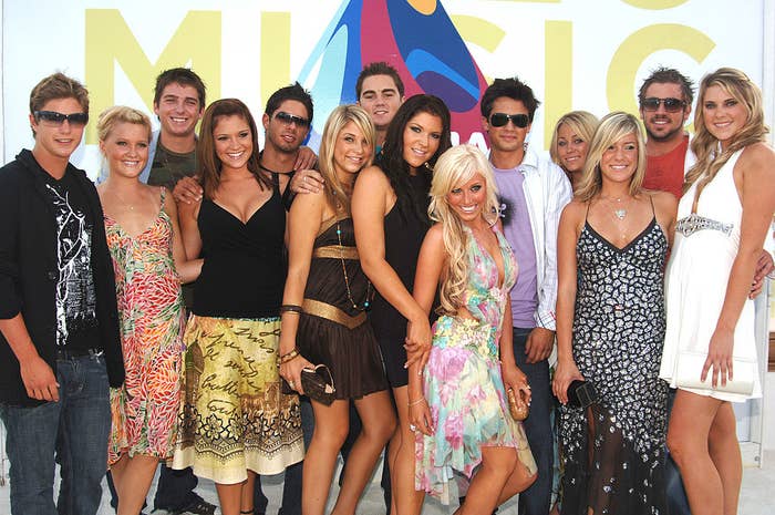 the cast posing together at an event