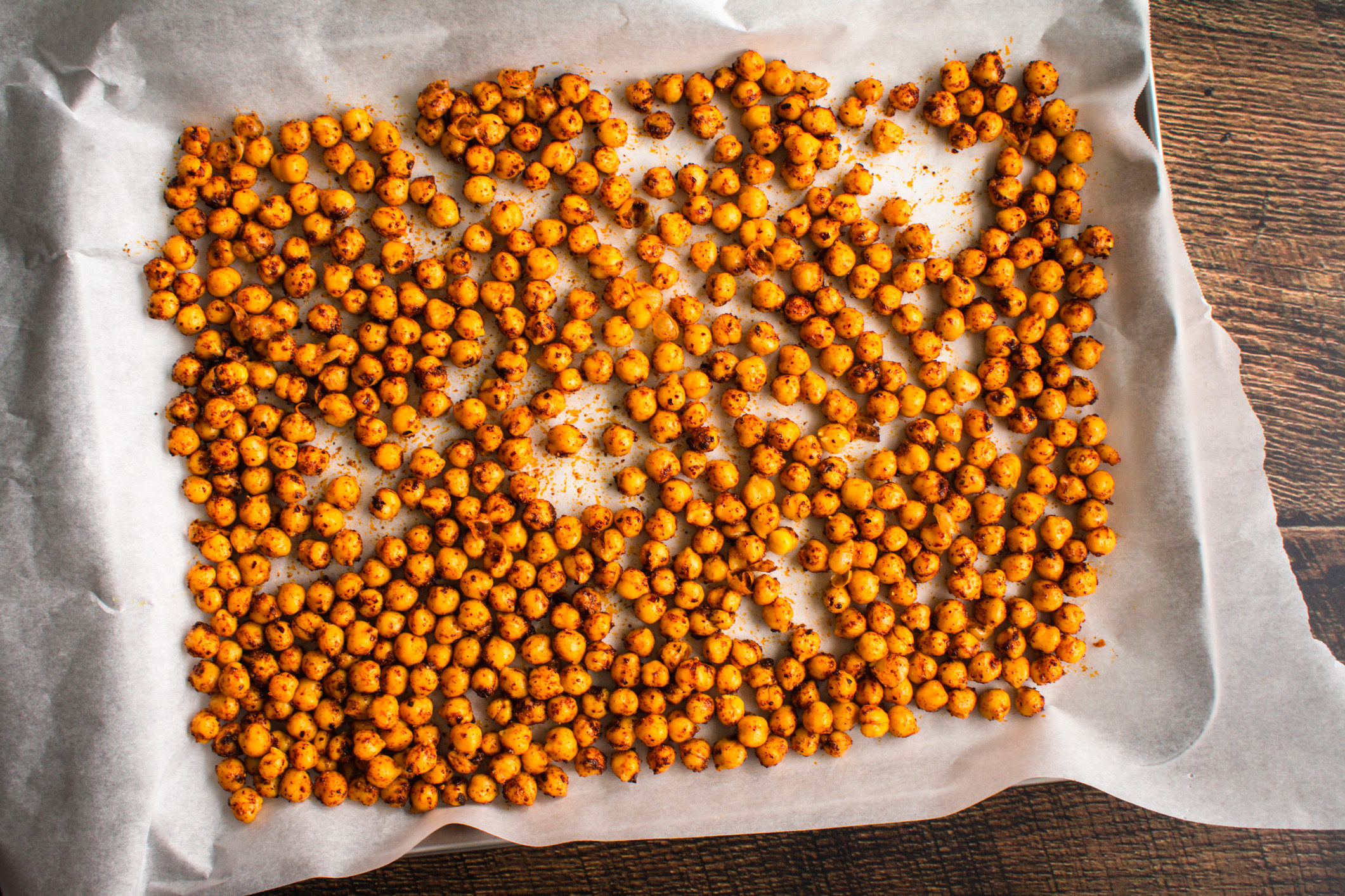 Roasted spiced chickpeas on parchment paper