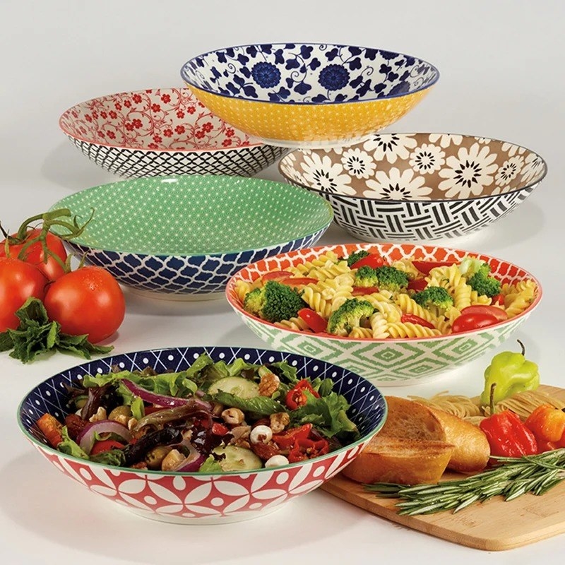 the four bowls in different colors and patterns
