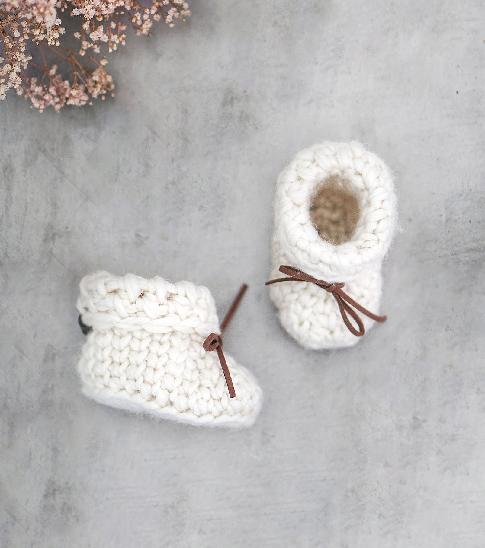 two crocheted booties