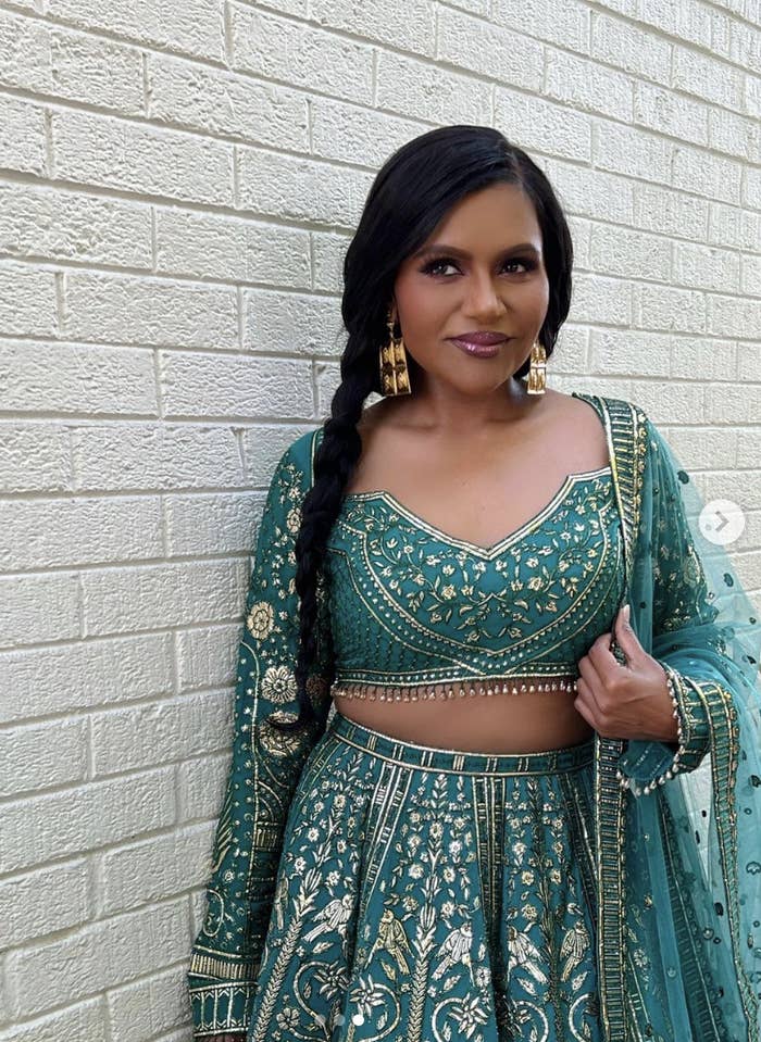 Mindy wearing a gorgeous green lehenga