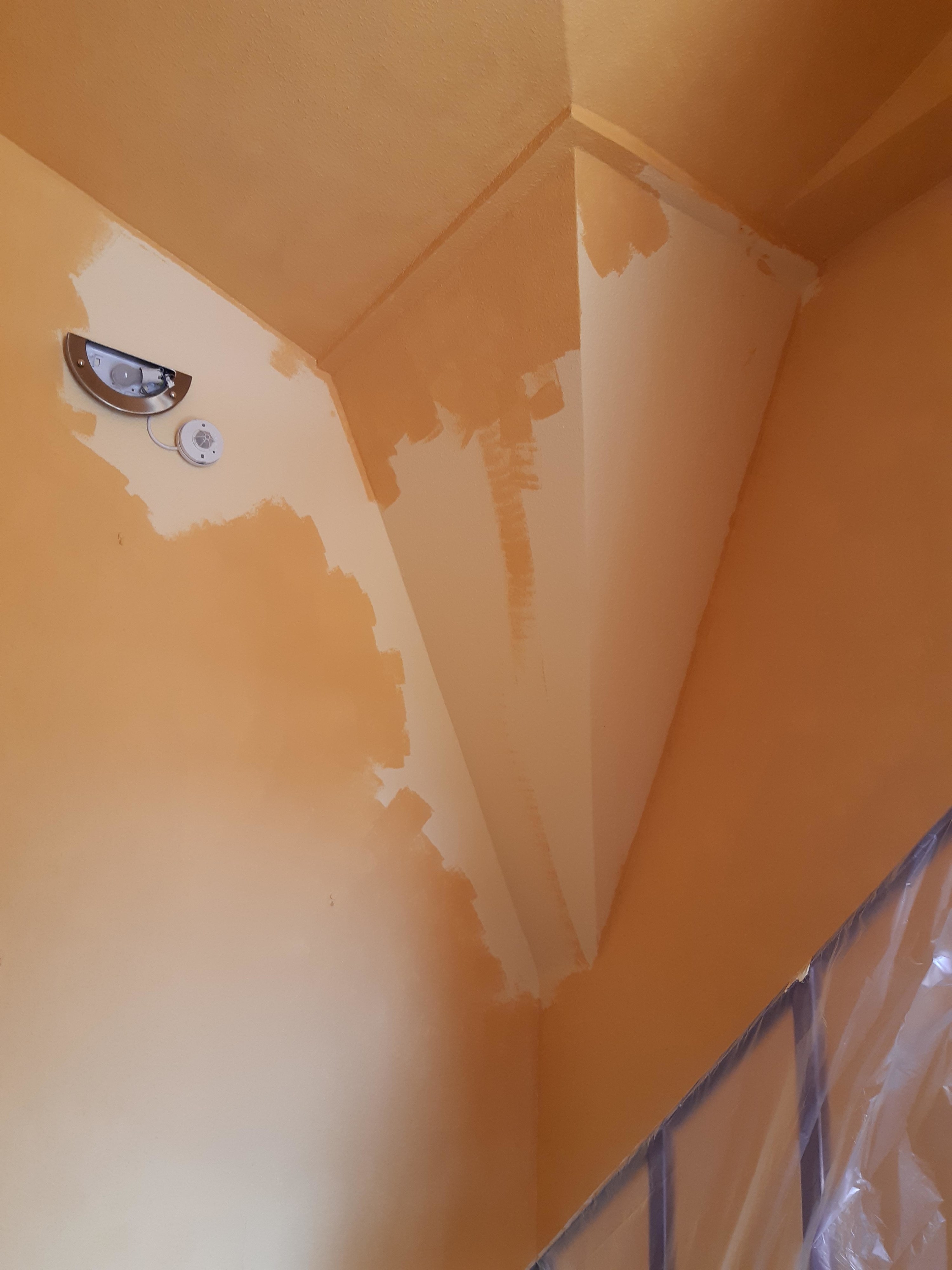 Barely painted wall and ceiling