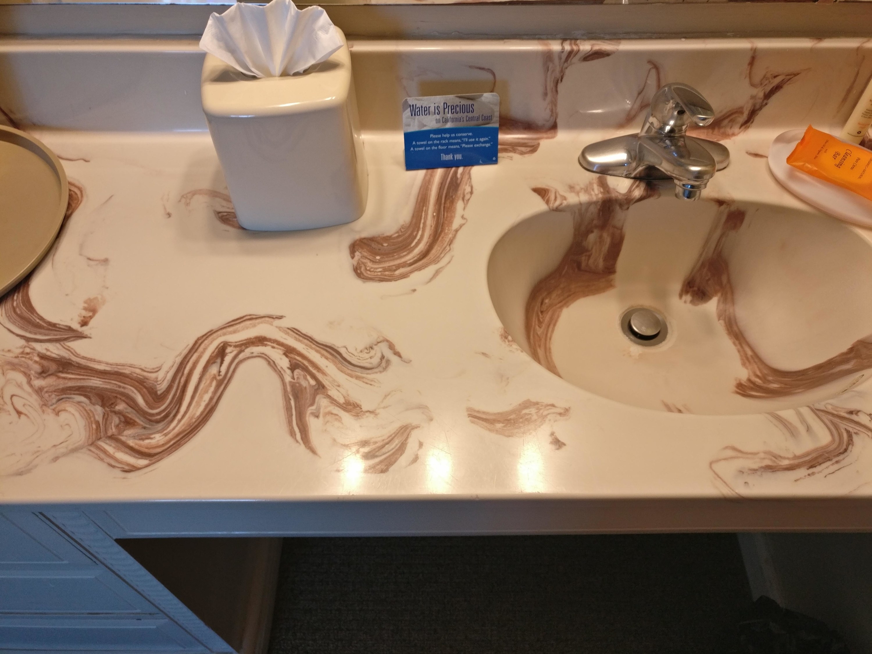 Brown swirl design on sink