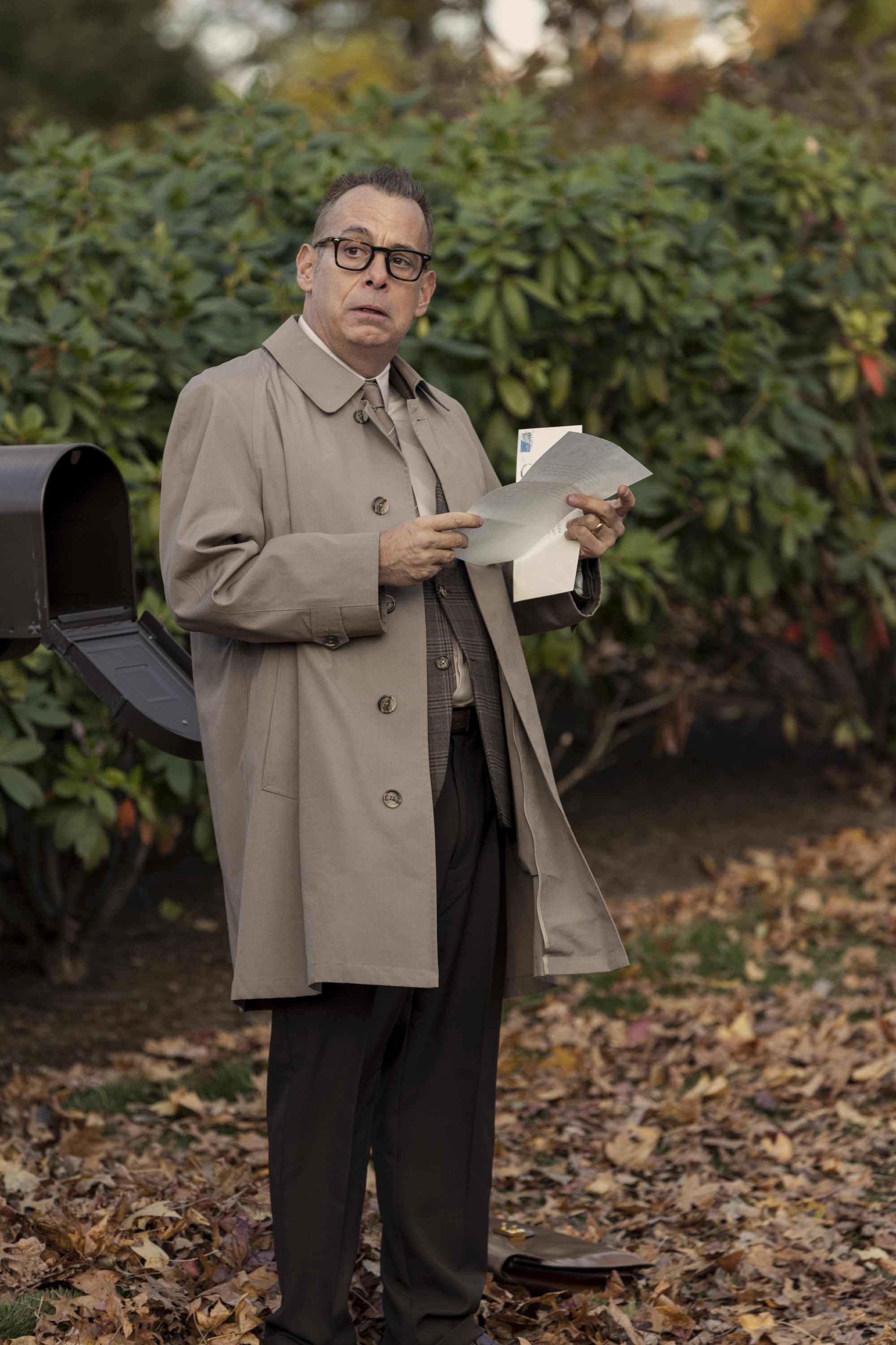 Joe Mantello as Graff in &quot;The Watcher&quot; opening a letter while standing outside