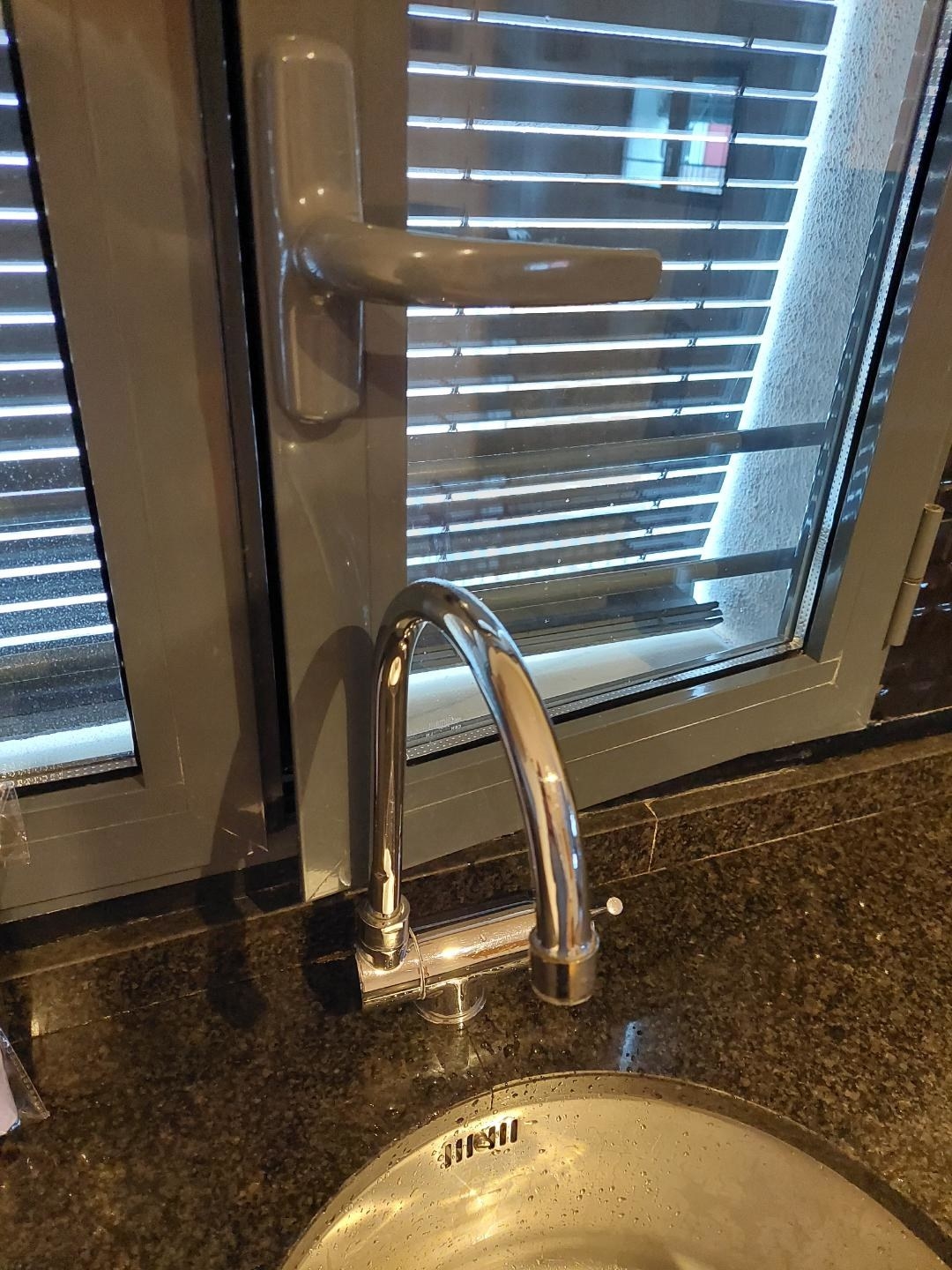 Sink faucet blocking a window from opening out