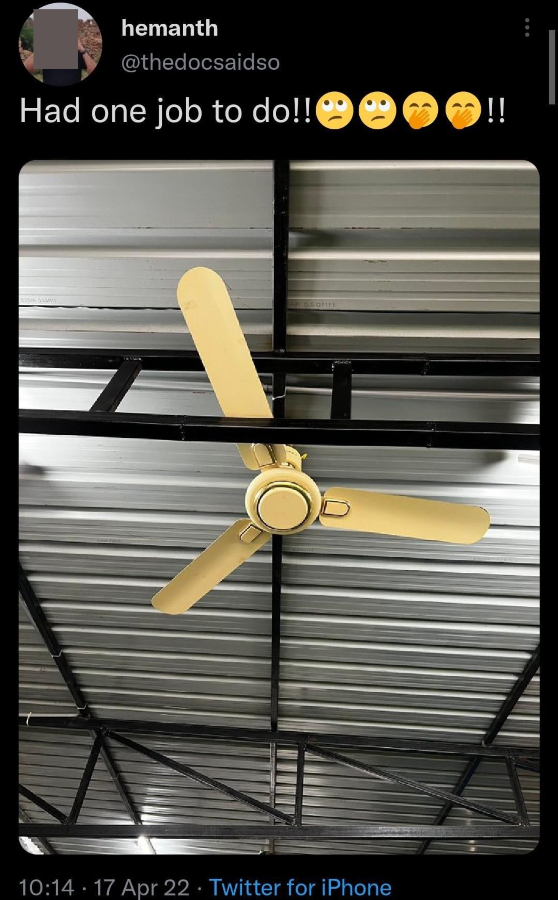A ceiling fan amid scaffolding