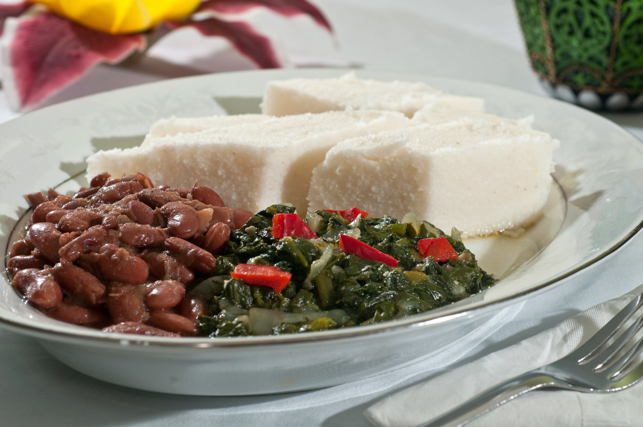 plate with beans, greens, and ugali