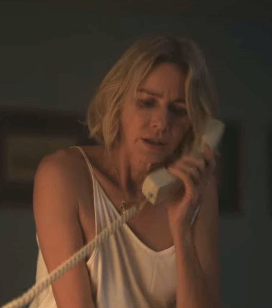An upset-looking Watts in &quot;The Watcher&quot; on the phone
