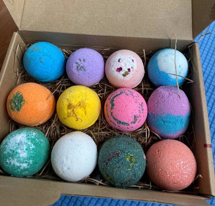 12 bath bombs in different colors and scents