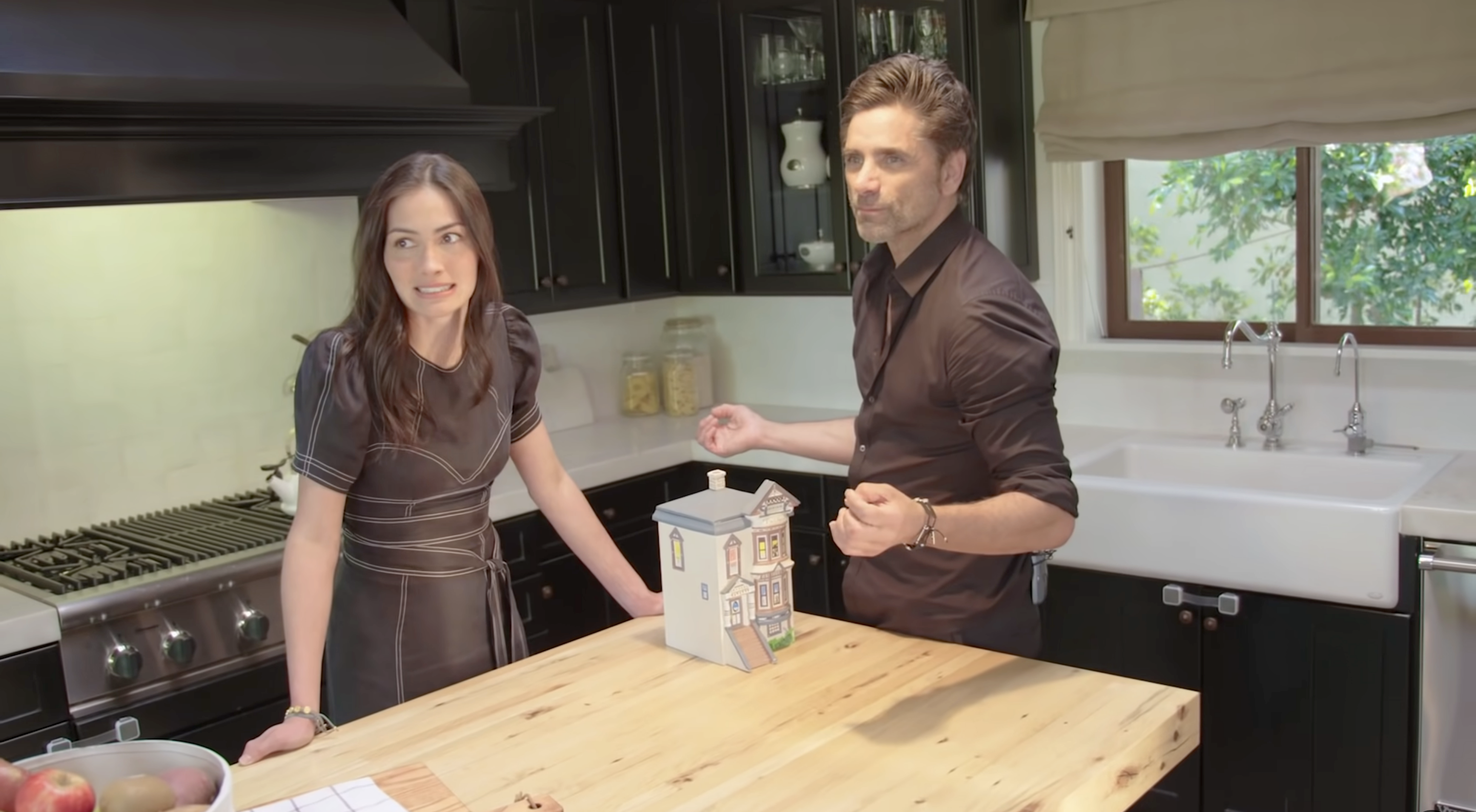 John and his wife in their kitchen