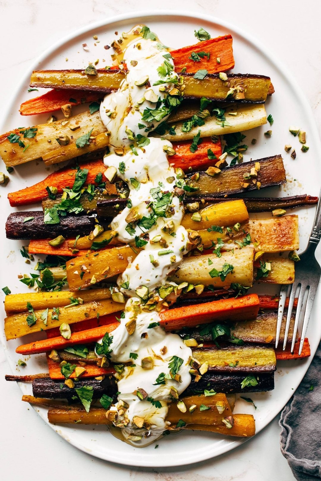 Roasted carrots with garlic sauce and nuts