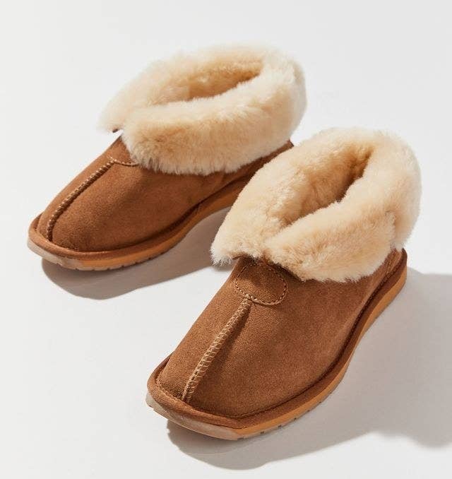 a pair of sheepskin slippers